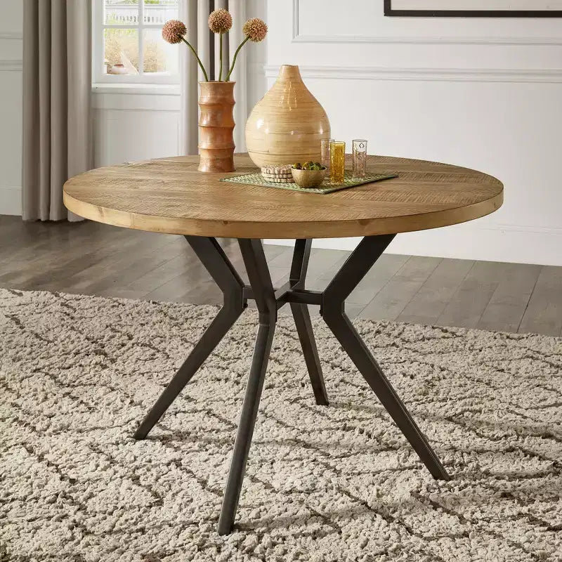 Mesa de comedor redonda para 4 personas con acabado en madera de pino claro/gris y base de metal en gris hierro